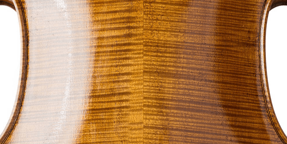 The back of a viola showing the varnishing process in progress